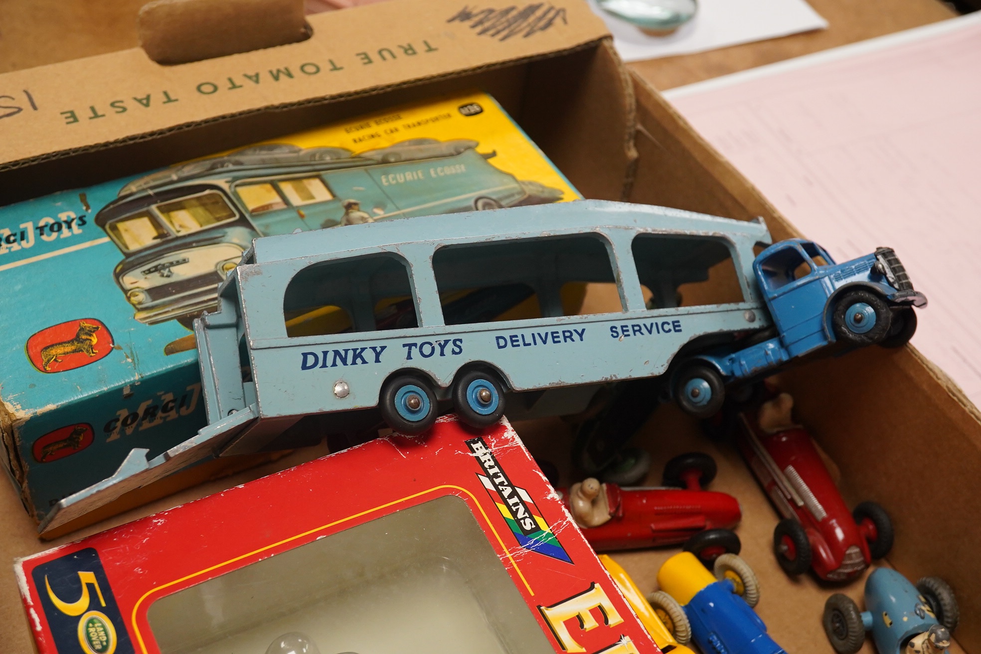 Ten diecast vehicles by Dinky Toys, Corgi Toys, Britains, and Crescent; a boxed Ecurie Ecosse Racing Car Transporter (1126), a Land Rover Series 1, A Pullmore car transporter, a Gordini GP racing car, a Ferrari F1, an Al